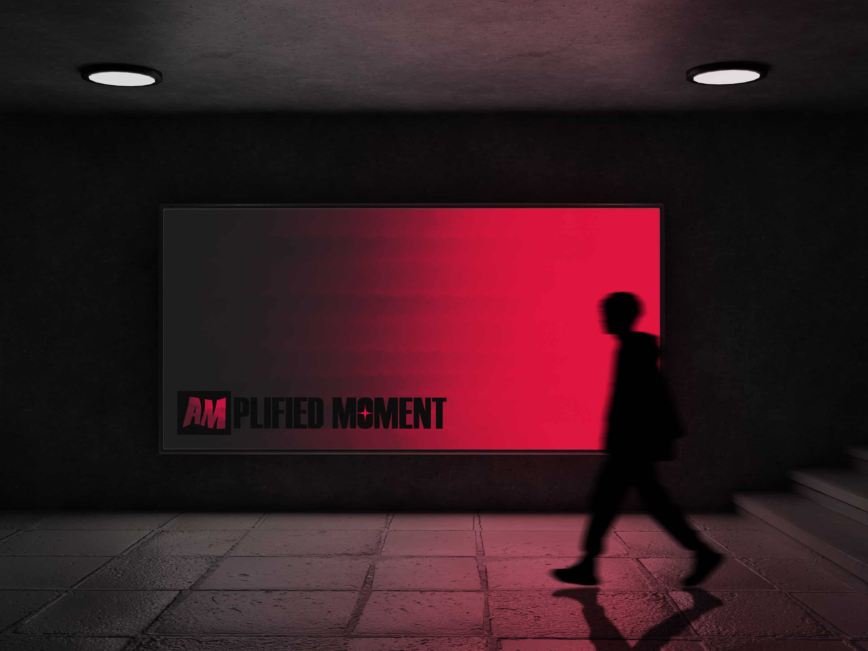 This picture shows a mockup design of the Amplified Moment branding project. The design is created by Sara Vukman and features a poster with the name of the brand.